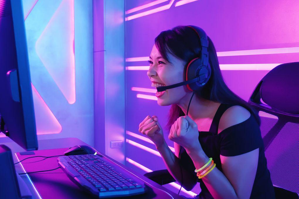 Woman excited in front of computer screen